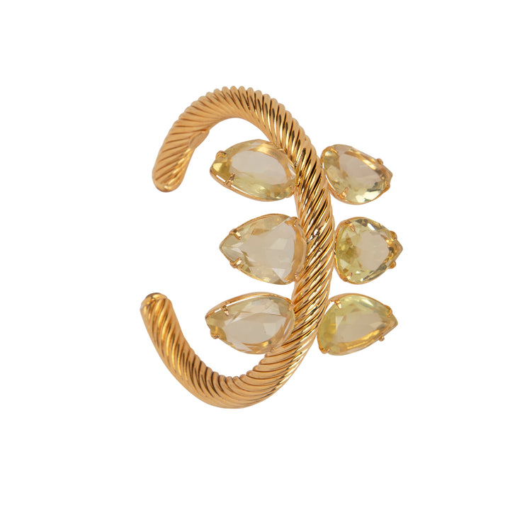 Gold earring with teardrop-shaped gemstones on a white background