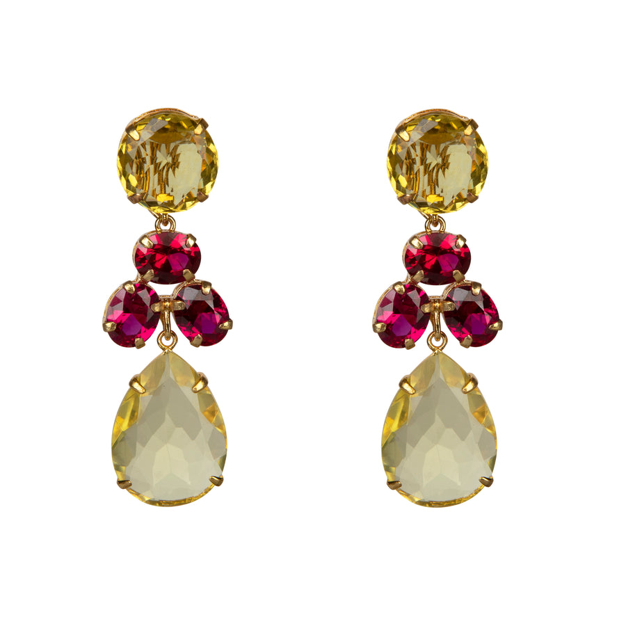 Gold earrings with yellow teardrop and red gemstone drops on a white background