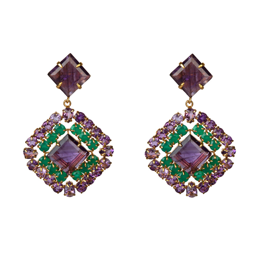 Pair of earrings with purple and green gemstones on a white background